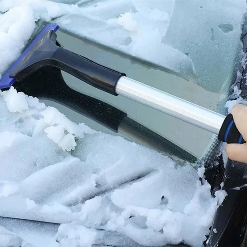 Scraper blade on a snowy windscreen